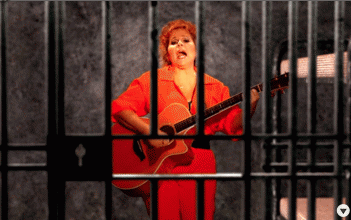 Ellen behind bars in 'Who's the Pusher Now?' music video