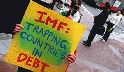 Ghana Seeks IMF Bailout As Currency Drops Due To Loss Of Investor Confidence In Excess Government Spending And Government Worker Wage Supports, From ImagesAttr