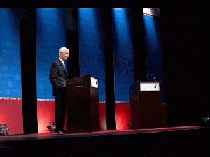 Florida Gov. Rick Scott delayed the start of a debate because of an electric fan below Democratic challenger Charlie Crist's podium.