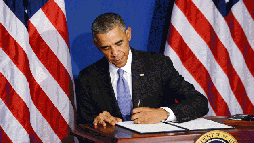 President Obama signing the recent BuySecure initiative, From ImagesAttr