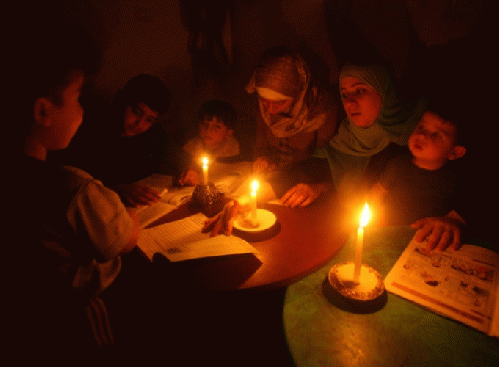 Gaza students study by candle light, From ImagesAttr