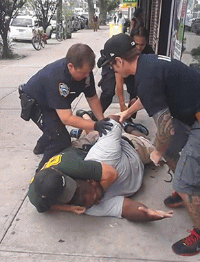 Eric Gerner being held on the ground in an illegal chokehold