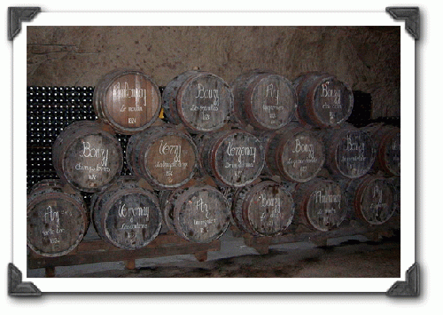 La Veuve Clicquot cellars, barrels with village and vineyard names.