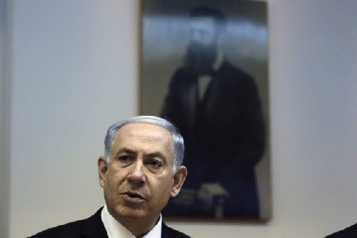 Israeli prime minister Benjamin Netanyahu sits in front of a picture of Theodor Herzl, the founder of modern Zionism., From ImagesAttr