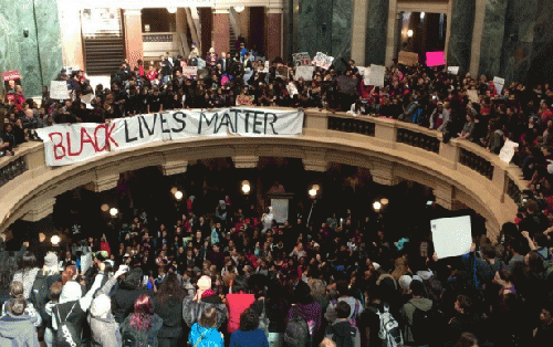 Crowds of junior high, high school, and college students fill the Wisconsin State Capitol to protest the police killing of Tony Robinson., From ImagesAttr