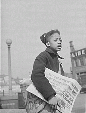 Newsboy selling the Chicago Defender