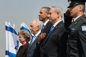 President Barack Obama stands with Israeli President Shimon Peres and Prime Minister Benjamin Netanyahu during the President Obama's official arrival ceremony in Tel Aviv, Israel, in 2013.