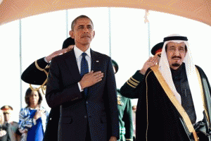 President Obama and King Salman Arabia stand at attention during the U.S. national anthem as the First Lady stands in the background with other officials., From ImagesAttr