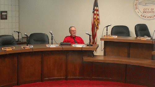 Pine Bluff Alderman Bill Brumett sits alone in City Council Chambers, From ImagesAttr