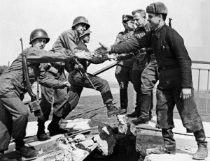 American and Soviet troops symbolically shake hands across the Elbe River on April 25, 1945, in the final days of World War II in Europe., From ImagesAttr