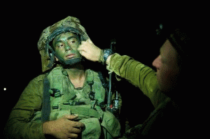 An Israeli soldier prepares for a night attack inside Gaza as part of Operation Protective Edge, which killed more than 2,000 Gazans in 2014., From ImagesAttr