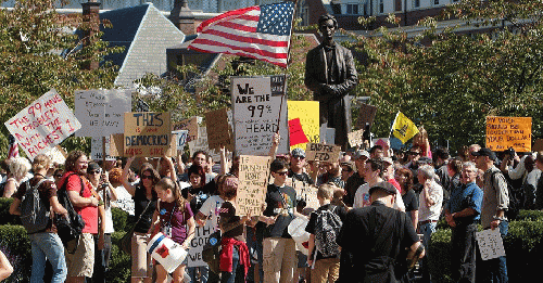 With a statue of Abraham Lincoln at center right, protesters begin their march through downtown Cincinnati during the Occupy Cincinnati protest, Saturday, Oct. 8, 2011., From ImagesAttr