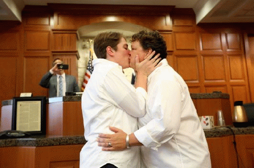 Ashley Creath, left, and Jacquey Creath, of Houston, a couple for nine years, are wed by Judge Kyle Carter, not shown, of the 125 District Court, in the Harris County Civil Courthouse Friday, June 26, 2015, in Houston., From ImagesAttr