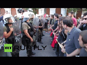 Scuffles broke out as thousands of protesters poured onto Syntagma Square in front of the Greek parliament in Athens to demand the country stays in Europe., From ImagesAttr