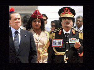 Muammar Gaddafi w gorgeous amazon guard, and , that berlusconi crook, From ImagesAttr