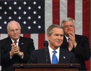 President George W. Bush pauses for applause during his State of the Union Address on Jan. 28, 2003. Seated behind him are Vice President Dick Cheney and House Speaker Dennis Hastert., From ImagesAttr