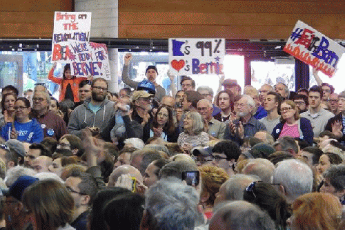 Attendees listening to candidate Bernie Sanders, From ImagesAttr