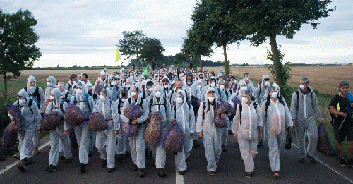 Early in the morning of 15 August, approximately 1,500 people set off from the climate camp in Germany's Rhineland to try and enter one of the vast open-cast lignite mines in the area and block the massive excavators. The Rhineland coalfields are the bigg, From ImagesAttr