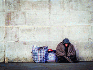 Homeless by a Wall