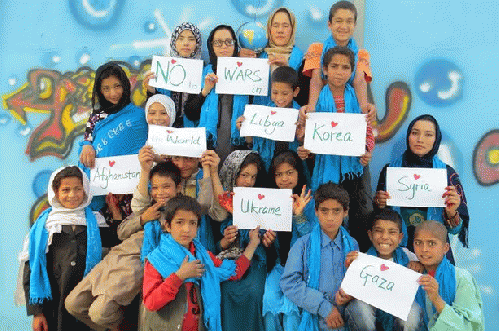 Afghan Street Children with volunteers at the Borderfree Center, From ImagesAttr