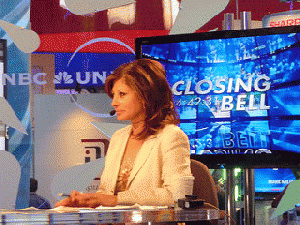 Lavishly paid celebrity journo Bartiromo at her desk: cheerfully spreading ignorance and misinformation about social and economic realities., From ImagesAttr