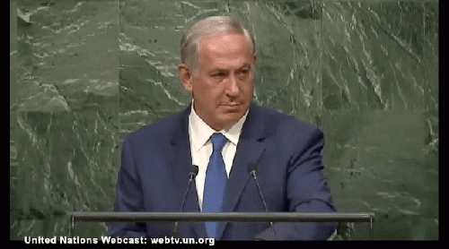 Netanyahu glaring at UNO audience. The man is nothing if not shamelessly audacious., From ImagesAttr