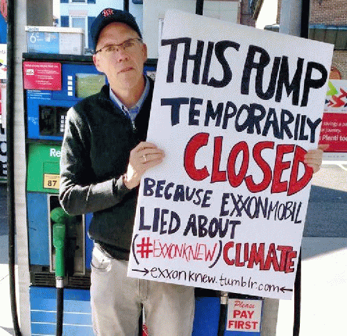 Bill McKibben staging a protest at a gas station in Burlington, Vermont., From ImagesAttr