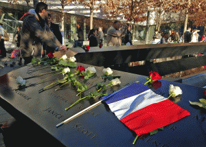 The National September 11 Memorial becomes a place to mourn the victims of another terrorist atrocity in the wake of the horrific attacks in Paris last week., From ImagesAttr