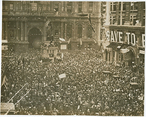 First News of Peace! Confetti thrown by happy crowds. Liberty sings. Flags waved. Nov. 11-1918.
