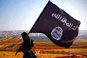 An ISIS jihadi carries the ISIS flag