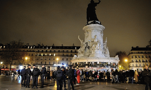 People gather in tribute to the victims of the Paris attacks at the Place de la Republique., From ImagesAttr