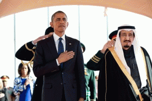 President Obama and King Salman Arabia stand at attention during the U.S. national anthem as the First Lady stands in the background with other officials on Jan. 27, 2015, at the start of Obama's State Visit to Saudi Arabia., From ImagesAttr