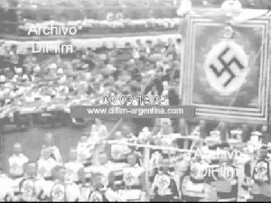 DiFilm - Military parade with soldiers carrying flags swastika 1938 Germany: Military parade with Nazi soldiers carrying flags with the symbol of the swastika. (Image no sound) Alemania: Desfile militar con soldados nazis ..., From YouTubeVideos