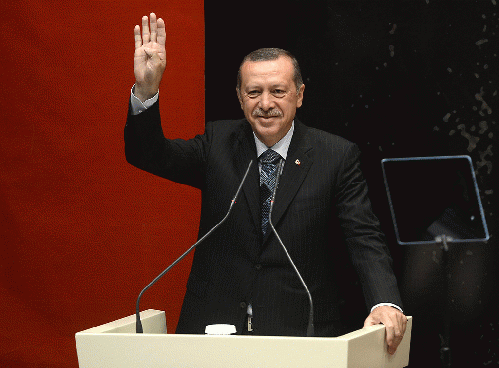 ErdoÄŸan is making Rabia sign for solidarity with Muslim Brotherhood protesters after 2013 Egyptian coup d'etat, From ImagesAttr