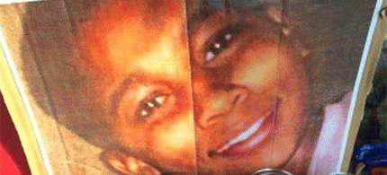 A poster of slain 12-year-old Tamir Rice rests within a memorial at the Cudell Recreation Center in Cleveland, Ohio., From ImagesAttr