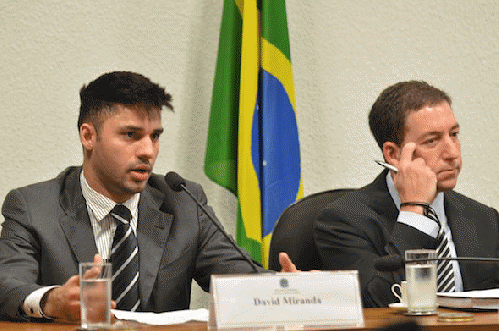 Journalist Glenn Greenwald, right, and his partner, David Miranda, testifying in Brazil in 2013 on U.S. government spying on that country., From ImagesAttr