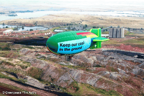 The Greenpeace Thermal Airship A.E. Bates flies over the Decker Coal Mine., From ImagesAttr