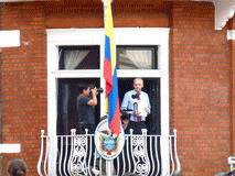 Assange on the balcony of the Ecuadorian Embassy in London has been ruled by the UN to be unlawfully detained by the UK, From ImagesAttr