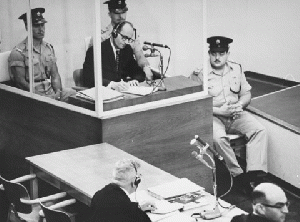 Adolf Eichmann takes notes during his trial USHMM 65268, From WikimediaPhotos