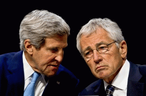 Defense Secretary Chuck Hagel, right, and Secretary of State John Kerry confer as they testify on the potential use of military force in Syria before the Senate Foreign Relations Committee in Washington, D.C., Sept. 3, 2013.