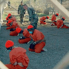 Detainees sit in a holding area in Guantanamo Bay. Trump has vowed to expand the prison., From GoogleImages