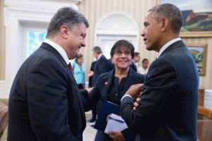 President Barack Obama talks with President Petro Poroshenko of Ukraine and Commerce Secretary Penny Pritzker following a bilateral meeting in the Oval Office, Sept. 18, 2014.