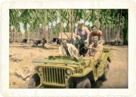 Gil Palast (1921-2010) in Jeep WWII Pacific Theater (passenger seat) 1944, From ImagesAttr