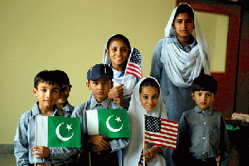 Pakistani Children pose with American and Pakistani flags, From FlickrPhotos