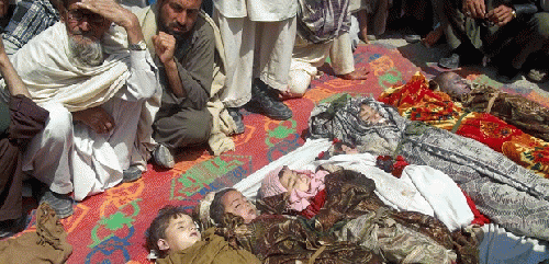 Afghan villagers sit near the bodies of children killed by U.S. drone, From ImagesAttr