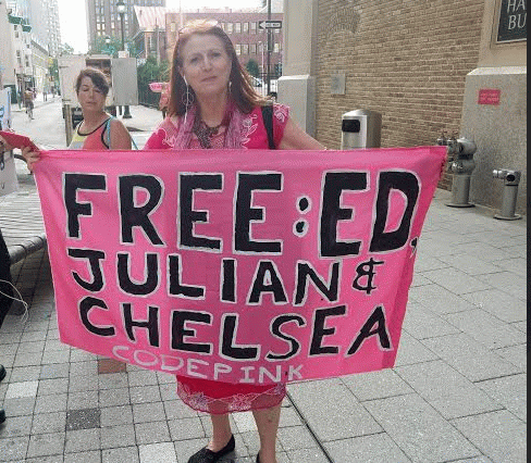 Code Pink's Jodie Evans showing the sign she was going to unfurl at the DNC convention later in the evening