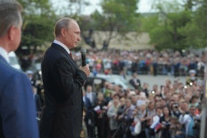 Russian President Vladimir Putin addresses a crowd on May 9, 2014, celebrating the 69th anniversary of victory over Nazi Germany and the 70th anniversary of the liberation of the Crimean port city of Sevastopol from the Nazis. Russian President Vladimir Putin addresses a crowd on May 9, 2014, celebrating the 69th anniversary of victory over Nazi Germany and the 70th anniversary of the liberation of the Crimean port city of Sevastopol from the Nazis.