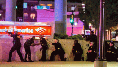 Dallas police under attack by snipers during a police brutality demonstration