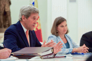 U.S. Secretary of State John Kerry, flanked by Assistant Secretary of State for European and Eurasian Affairs Victoria 