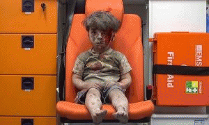 Five-year-old Omran Daqneesh sits in the back of an ambulance after a military strike in the rebel-held neighborhood of Qaterji in Aleppo.